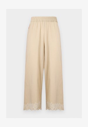 Beżowe spodnie o szerokich nogawkach z elastycznym pasem i haftowanymi falistymi wykończeniami na dole.