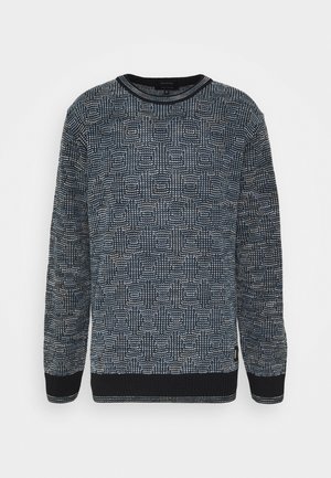 Long-sleeve crewneck sweater with black and white geometric textured pattern, ribbed cuffs and hem, displayed on a white background.