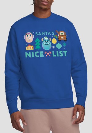 Blue sweatshirt featuring colorful cartoon characters and holiday motifs, with “SANTA’S NICE LIST” printed prominently in green and red.