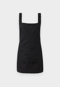 Musta hihaton mekko, jossa on neliömäinen pääntie, valmistettu sileästä kankaasta. Mekossa on muotoiltu siluetti ja se ulottuu keskipolven ylle.