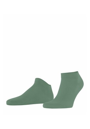 Paire de chaussettes chevilles vertes unies présentées sur fond blanc.