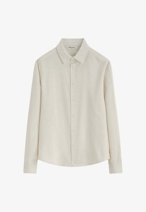 Chemise beige à manches longues et boutonnée, avec un col pointu, présentée à plat sur fond blanc. Aucun motif ni décoration visible.