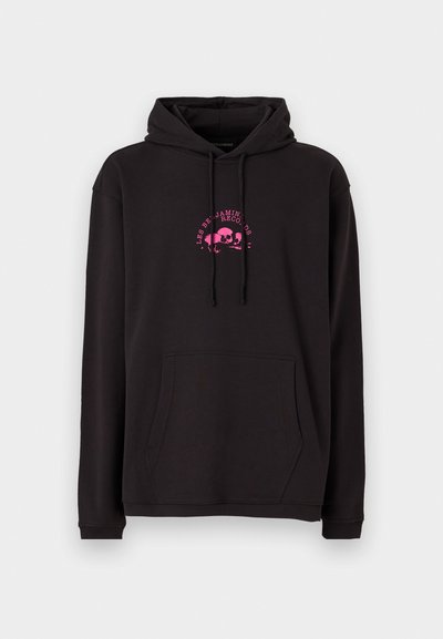 Black hoodie made of soft fabric featuring a front pocket, adjustable drawstring hood, and pink skull graphic with text on the chest.