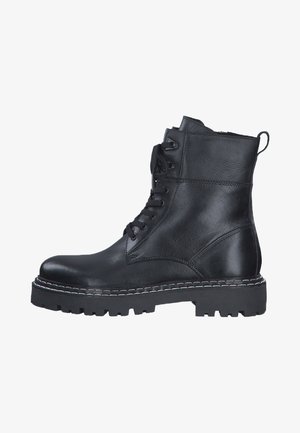 Schwarze Leder Stiefeletten mit Schnürung, runder Zehenform und dicker Gummisohle. Verfügt über kontrastierende weiße Nähte entlang der Sohlenkante.