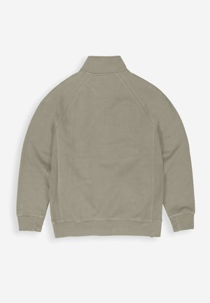 Olivgrüne Fleecejacke mit hohem Kragen, Raglanärmel und gerippten Bündchen, die über eine glatte Textur und unaufdringliche Nähdetails verfügt.