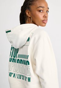 The North Face COORDINATES CROP HOODIE - Športni pulover - white dune