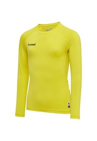 Langarm sportshirt in felgeel, gemaakt van zachte stof met een aansluitend ontwerp. Voorzien van een logo op de borst.