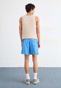 Nike Sportswear FINE - Treningo apatinė dalis - light photo blue
