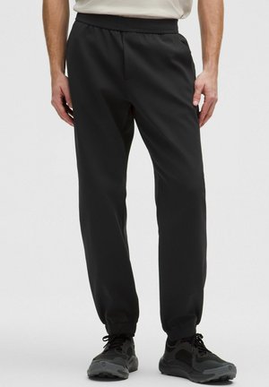 SOJOURN JOGGER REGULAR - Jogginghose - black
