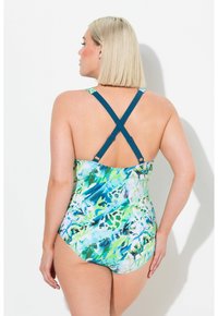 Maillot de bain une pièce avec un motif floral bleu et vert, doté de bretelles croisées ajustables, d'un dos en scoop et d'une texture de tissu lisse.