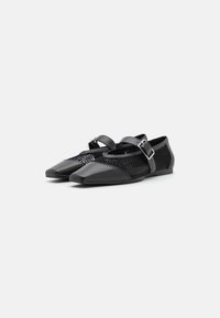 Black flat shoes with a pointed toe, featuring a mesh upper, a buckled strap, and glossy accents, combining synthetic materials and a textured design.