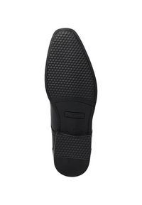 Semelle de chaussure en cuir noir avec une grip en caoutchouc texturé. Présente une forme arrondie et une finition lisse avec un label de marque embossé près du talon.