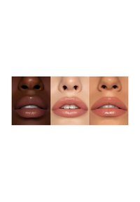Three close-up views of lips in varying skin tones. Left: deep brown, center: light beige, right: warm peach. All lips have a glossy finish.