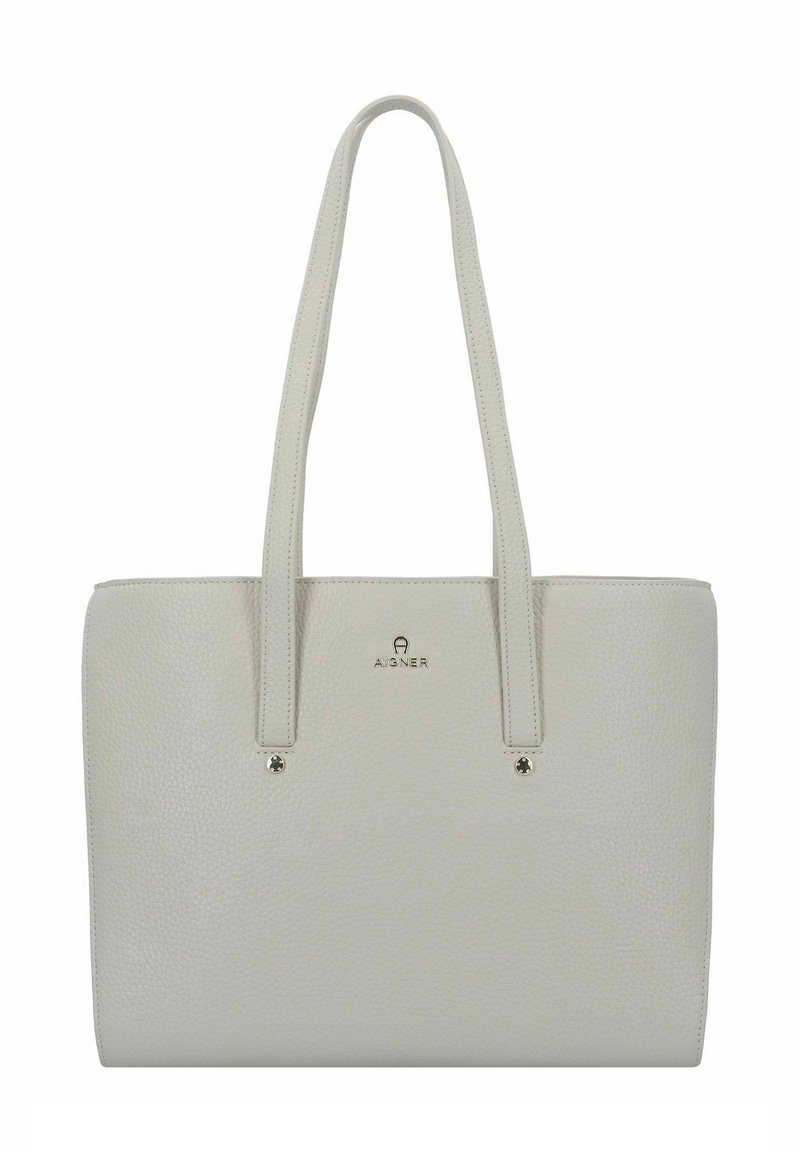 Grau strukturiertes Ledertragebag mit zwei langen Griffen, einem Logo auf der Vorderseite und silberfarbenen Hardwareakzenten. Entworfen für den täglichen Gebrauch.