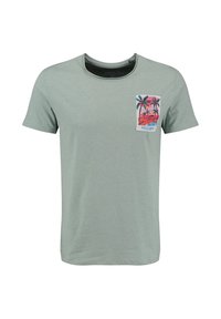 Jasnozielona koszulka z krótkim rękawem z małą, kolorową grafiką tropikalnej palmy i napisem "Key Largo" na lewej stronie kieszeni piersiowej.