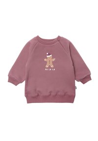 Pink sweatshirt with long sleeves, ribbed cuffs, and hem. Features a gingerbread figure graphic with "FA LA LA" text in white below. Soft texture.