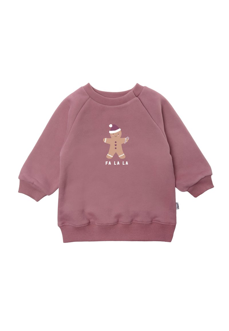 Pink sweatshirt with long sleeves, ribbed cuffs, and hem. Features a gingerbread figure graphic with "FA LA LA" text in white below. Soft texture.