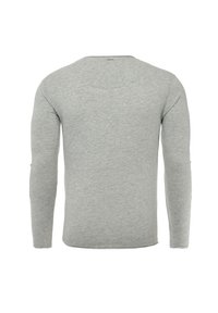 Graues Langarmshirt aus weichem Stoff. Verfügt über einen runden Halsausschnitt und ein schlichtes Design, ohne sichtbare Muster oder Akzente.