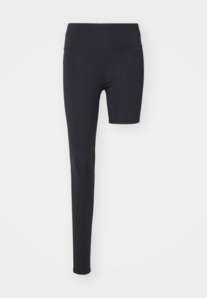 Sorte leggings med høy midje, med et enbeinsdesign; laget av glatt, elastisk stoff egnet for aktiv bruk.