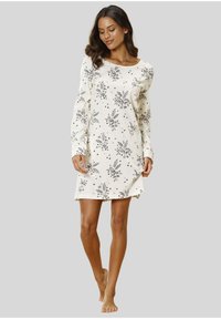 Robe crème avec imprimé floral en vert et rose, manches longues et coupe décontractée, avec un léger d étail d'ourlet.