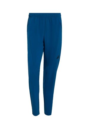 Blaue Sporthose mit schmal zulaufendem Schnitt, elastischem Bund und Seitentaschen. Verfügt über schwarze Logoakzente und glattes, leichtes Material.