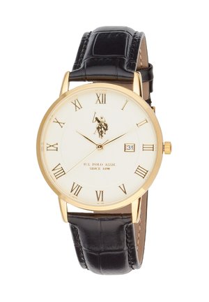 Goldene runde Uhr mit weißem Zifferblatt, schwarzem Lederarmband, römischen Ziffern, Datumsanzeige bei 3 Uhr und U.S. Polo Assn. Logo sowie Text auf dem Zifferblatt.