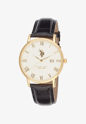Orologio tondo oro con quadrante bianco, cinturino in pelle nera, numeri romani, visualizzazione della data alle 3 e logo e testo U.S. Polo Assn. sul quadrante.