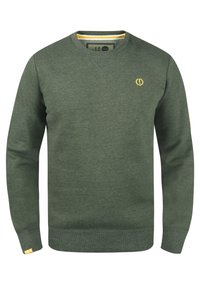 Green sweatshirt with a V-neck, long sleeves, and ribbed cuffs. Features a small yellow logo on the chest and a striped neckline detail.