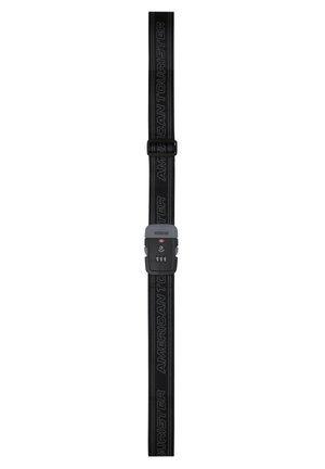 Black adjustable luggage strap with integrated combination lock, featuring "American Tourister" text along the strap length.
