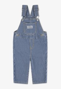Salopette en denim rayée bleue et blanche avec bretelles ajustables, poche avant, quincaillerie en argent et détails de couture jaunes.