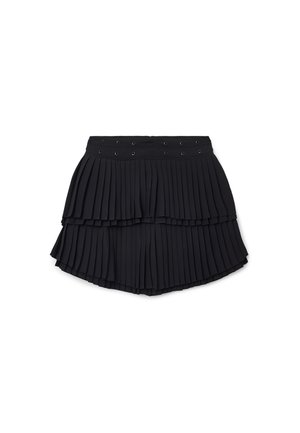 Black pleated skirt with two layers, featuring an elastic waistband and decorative grommets. Made from a smooth, lightweight fabric.