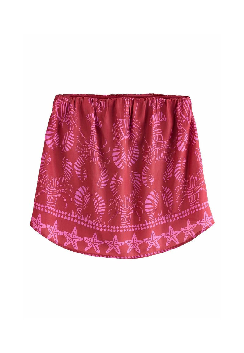 Rode rok met een geplooide tailleband, voorzien van roze bladeren en sterrenbeeldpatronen, en een decoratieve rand met stippen aan de zoom.