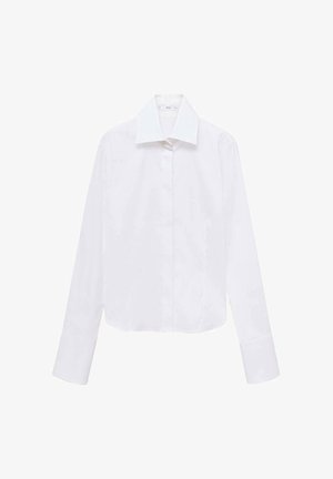 Valkoinen lyhyt cropped-paita pitkillä hihoilla, terävä kaulus ja nappi edessä. Valmistettu sileästä, kevyestä kankaasta. Ei näkyviä kuvioita tai yksityiskohtia.