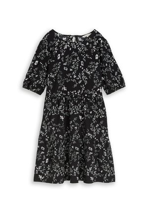 Black knee-length dress with white floral pattern, three-quarter puff sleeves, round neckline, and tiered skirt.