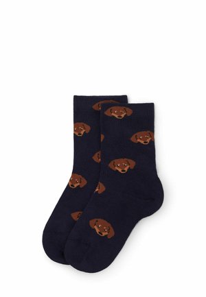 Marineblaue Socken mit einem sich wiederholenden Muster von braunen Hundeköpfen. Hergestellt aus einem gestrickten Material, haben sie eine glatte Textur und passen bequem.