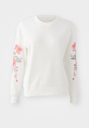Biała bluza z jasnym różowym haftem kwiatowym wzdłuż rękawów. Lekki materiał, okrągły dekolt oraz ściągacze na rękawach i u dołu.