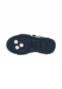 Suela de zapato de goma en color azul marino con una superficie texturizada, que presenta tres puntos blancos redondos y patrones de banda de rodadura definidos para un mejor agarre.