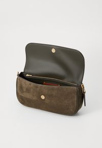 Brown suede clutch bag with a smooth, dark green leather lining. Features a gold zipper and a magnetic snap closure. Interior includes a card slot.
