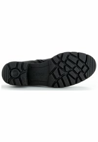 Semelle de chaussure noire en caoutchouc texturé, avec une indentation circulaire et le nom de la marque « Gabor » en relief. Design durable et fonctionnel.