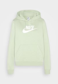 Ljusgrön huvtröja med en känguruficka, snörhuva och en stor vit Nike-logotyp framtill. Mjuk och slät textur.