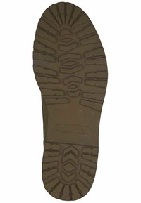 Brown rubber boot sole with a textured tread pattern featuring grooves and ridges for grip. Marked with size 37 and brand "Tamaris."
