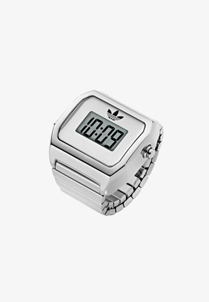Stříbrné digitální hodinky s kovovým páskem a zobrazují čas 10:09 a logo Adidas trefoil nad displejem.