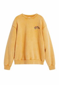 Gul bomulds sweatshirt med rund halsudskæring, dropped skuldre, ribbede manchetter og et lille broderet design på brystet.