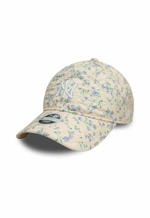 Beige quilted cap with an all-over floral pattern in purple and green. Features a white embroidered logo and curved brim.