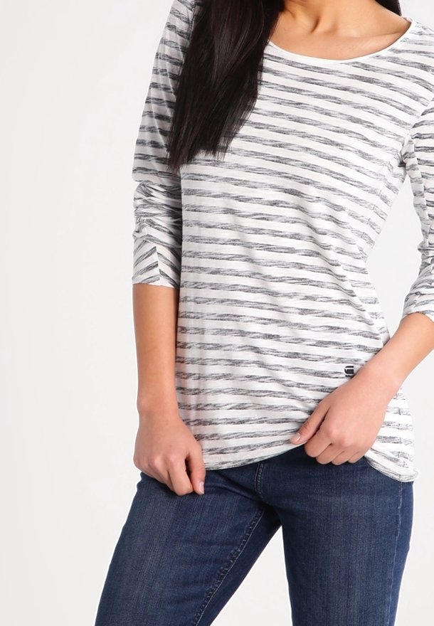Gestreiftes Langarmshirt aus weichem Stoff, mit schwarzen und grauen horizontalen Streifen auf weißem Hintergrund. Rundhalsausschnitt, lockere Passform.