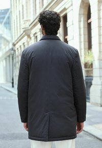 Next SHOWER RESISTANT WADDED LONG - REGULAR FIT - Jachetă parka - navy blue