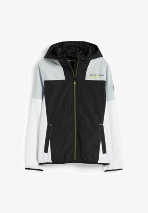 Veste coupe-vent légère avec un corps noir, des manches grises et des accents blancs. Comprend une capuche, une fermeture éclair complète, et le texte "BREAK IT DOWN".
