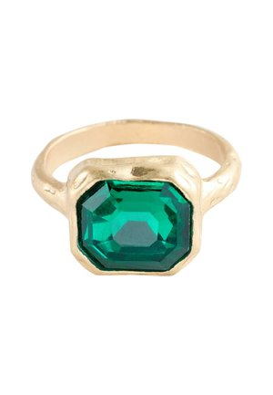 Gold ring featuring an octagonal green gemstone with facets. The band has a textured finish, complementing the stone's polished surface.