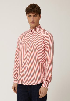 Red and white striped button-up shirt with long sleeves, featuring a spread collar and a small blue logo on the chest.