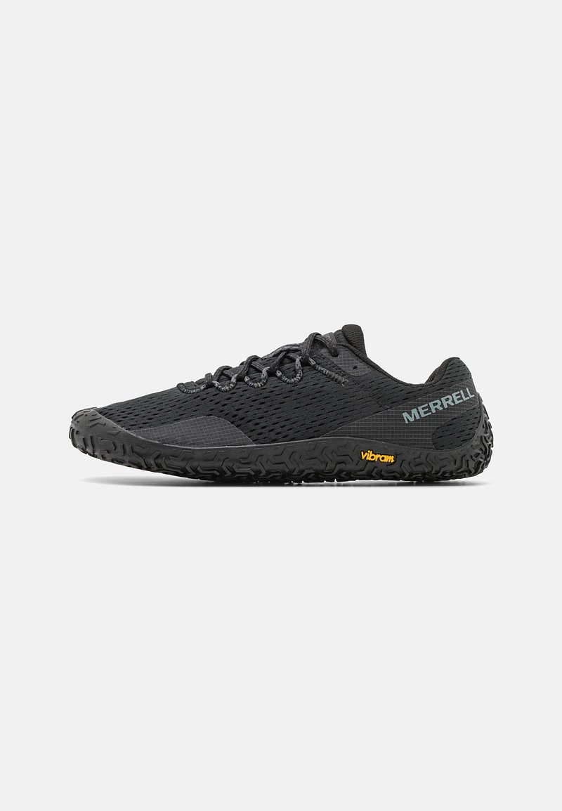 Black trail running shoes with a mesh upper, textured sole, and Vibram branding. Features a low profile and traditional laces for adjustment.